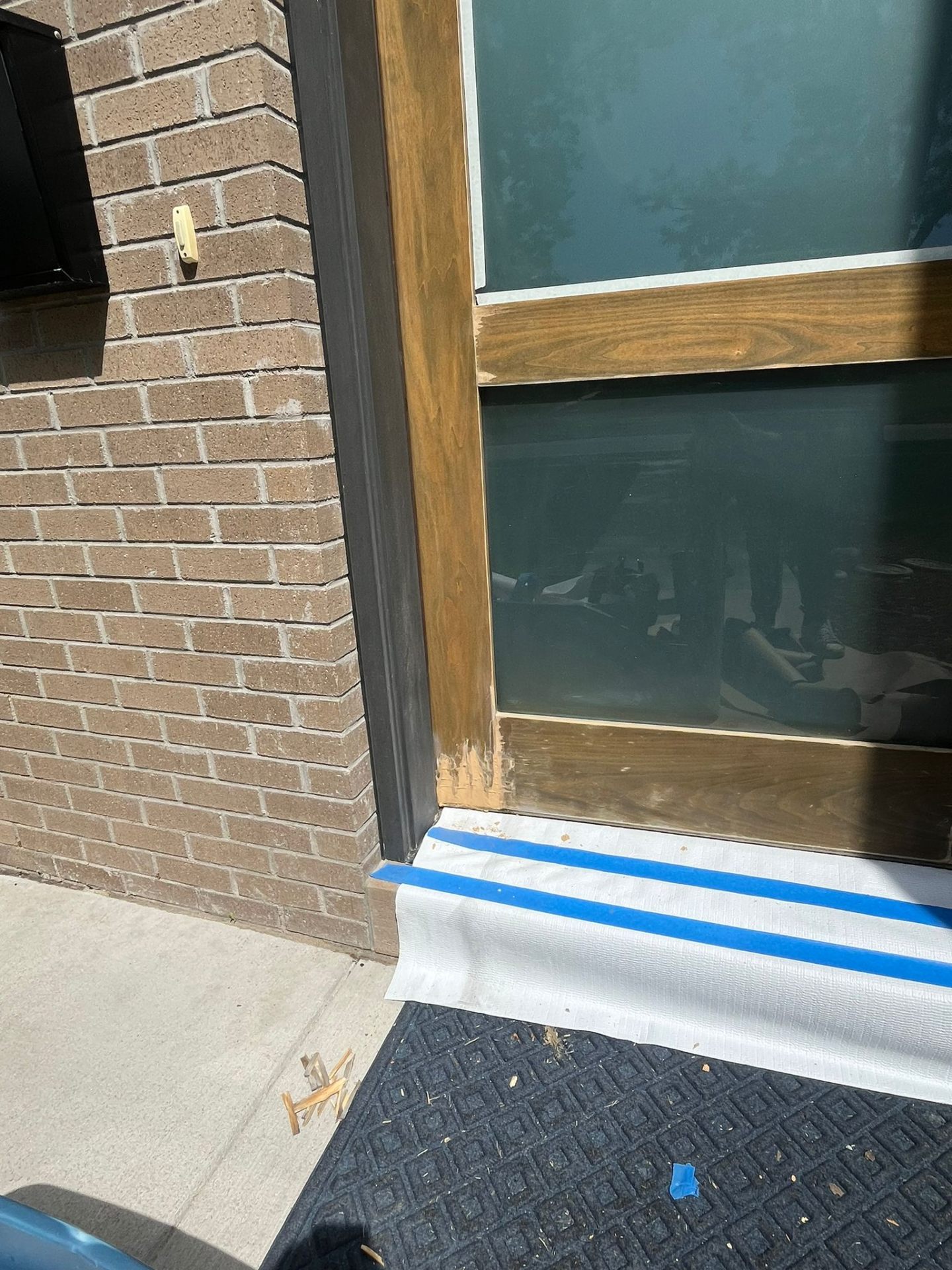 Detail work on door frame edges before painting