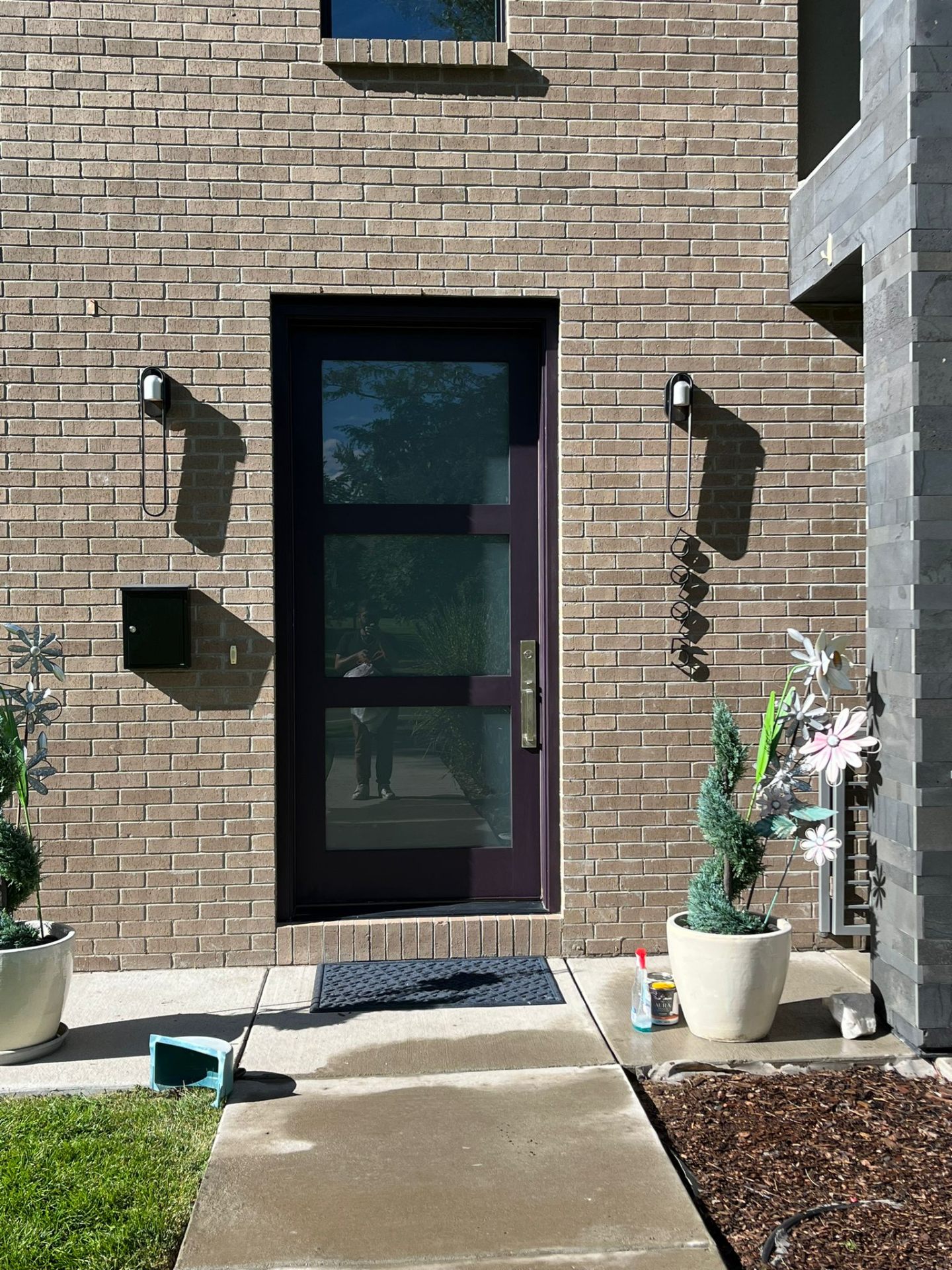 Finished plum-painted modern entry door — exterior painting by AZ Handyman