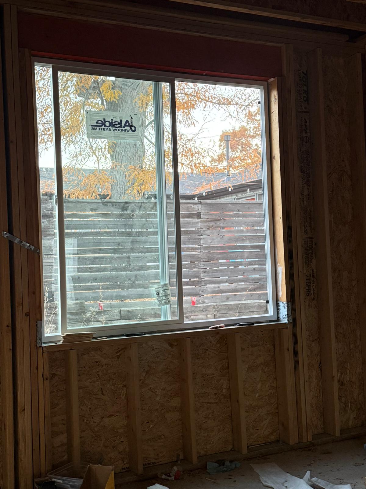 New sliding window installation — interior framing view