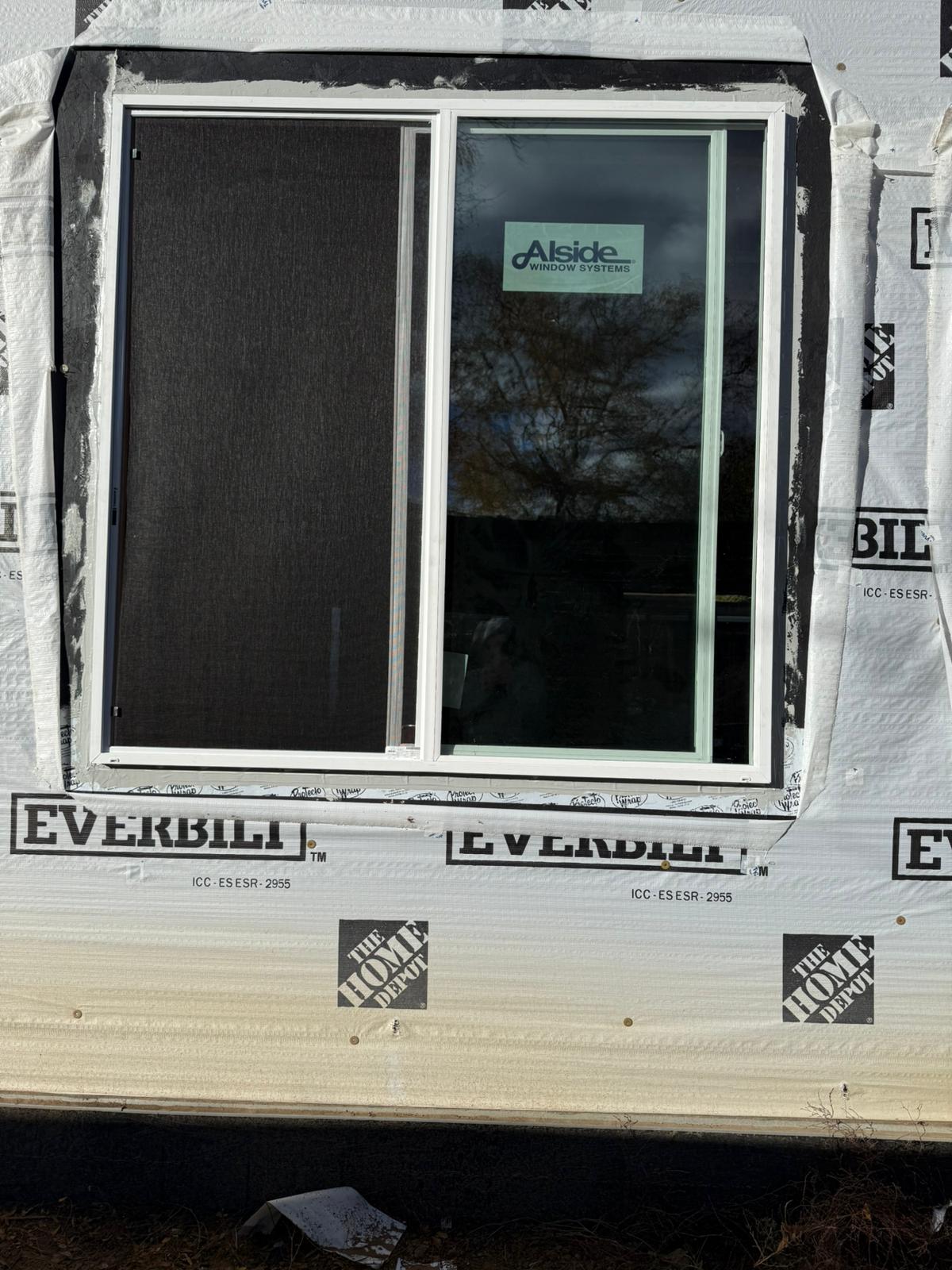 New window install with weather wrap — exterior view